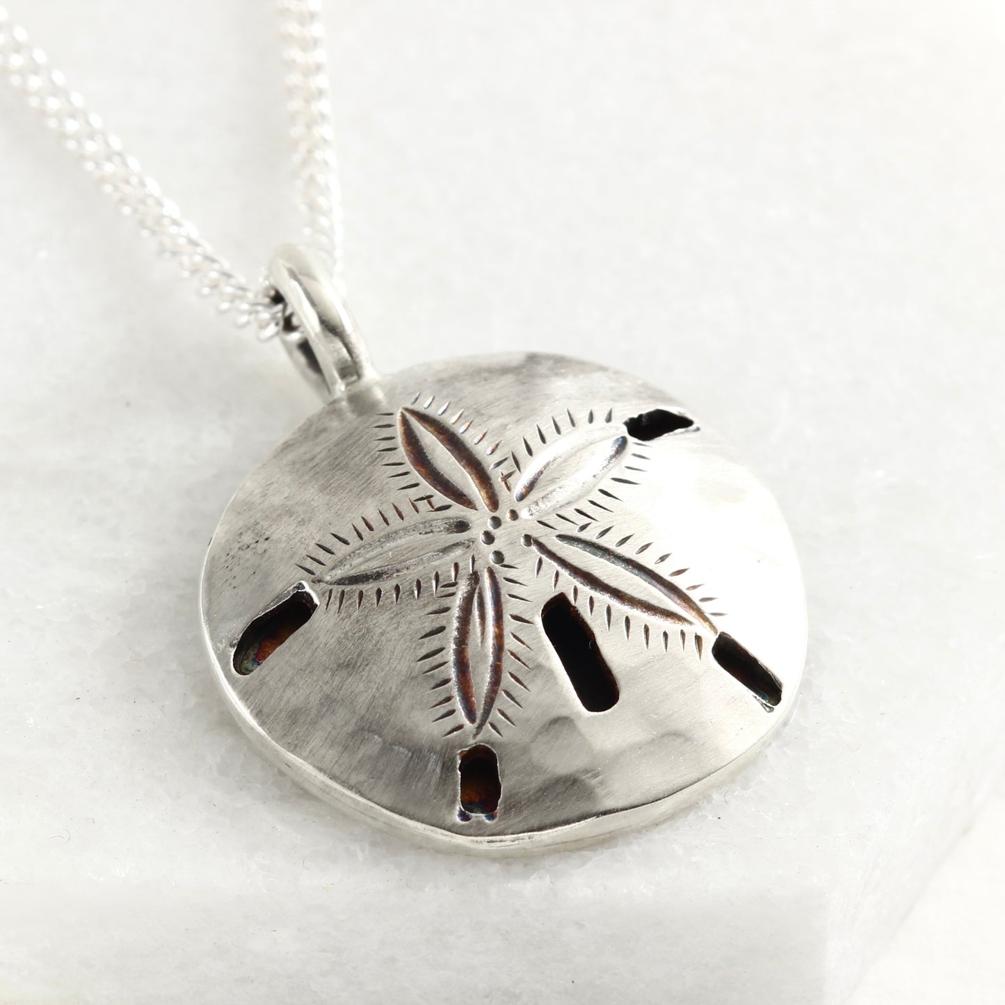 Sterling silver hand fabricated sand dollar pendant