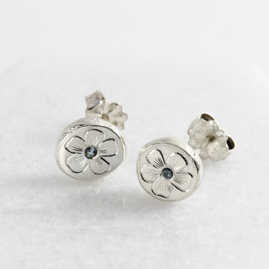 Hand engraved flower sterling silver post earrings with Montana sapphires