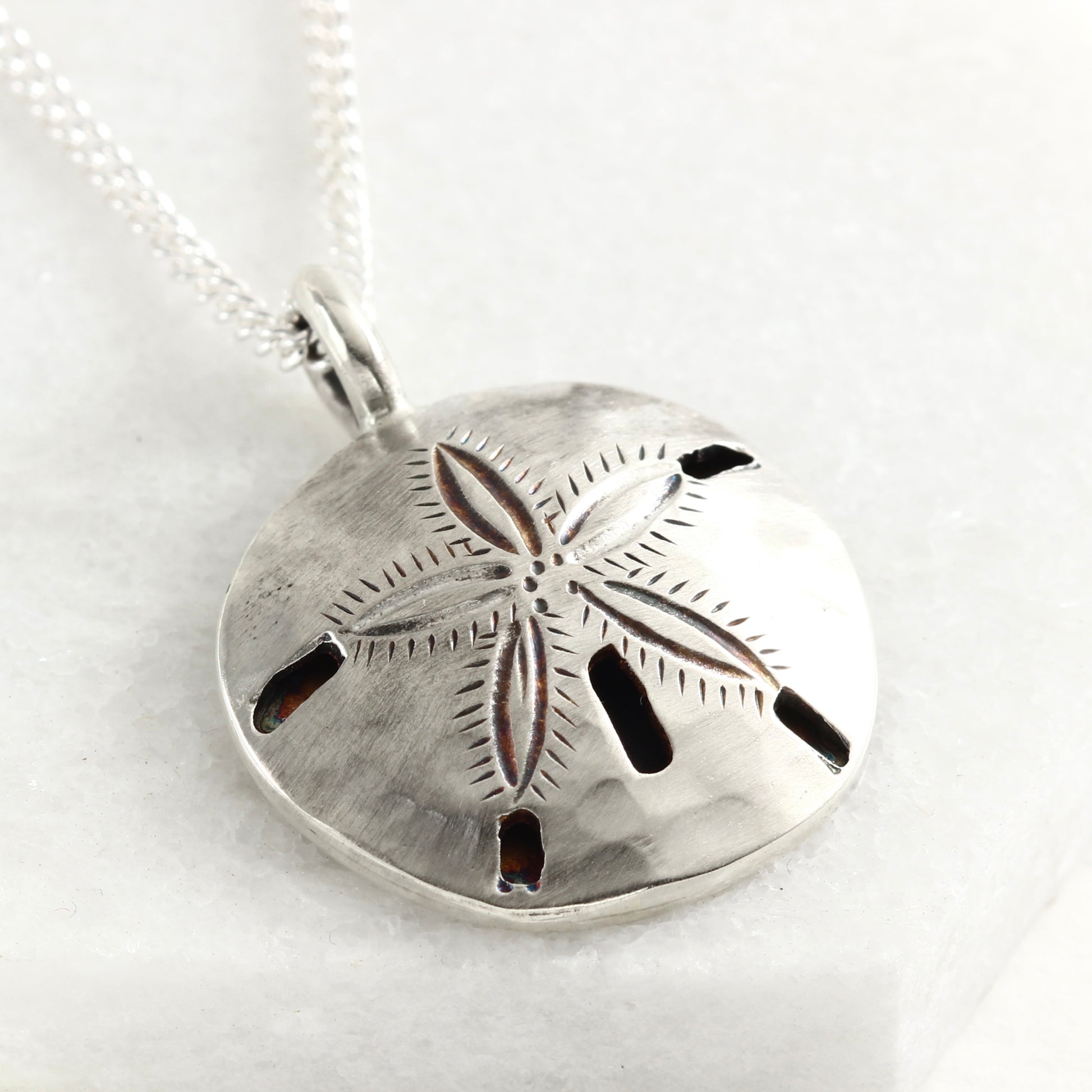 Sterling silver hand fabricated sand dollar pendant