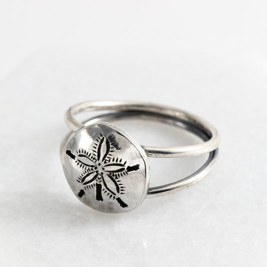 Hand fabricated and engraved sterling silver sand dollar ring