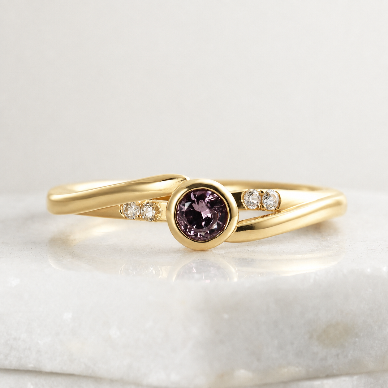 Front view of a solitaire ring featuring a large garnet and four small Montana sapphires.