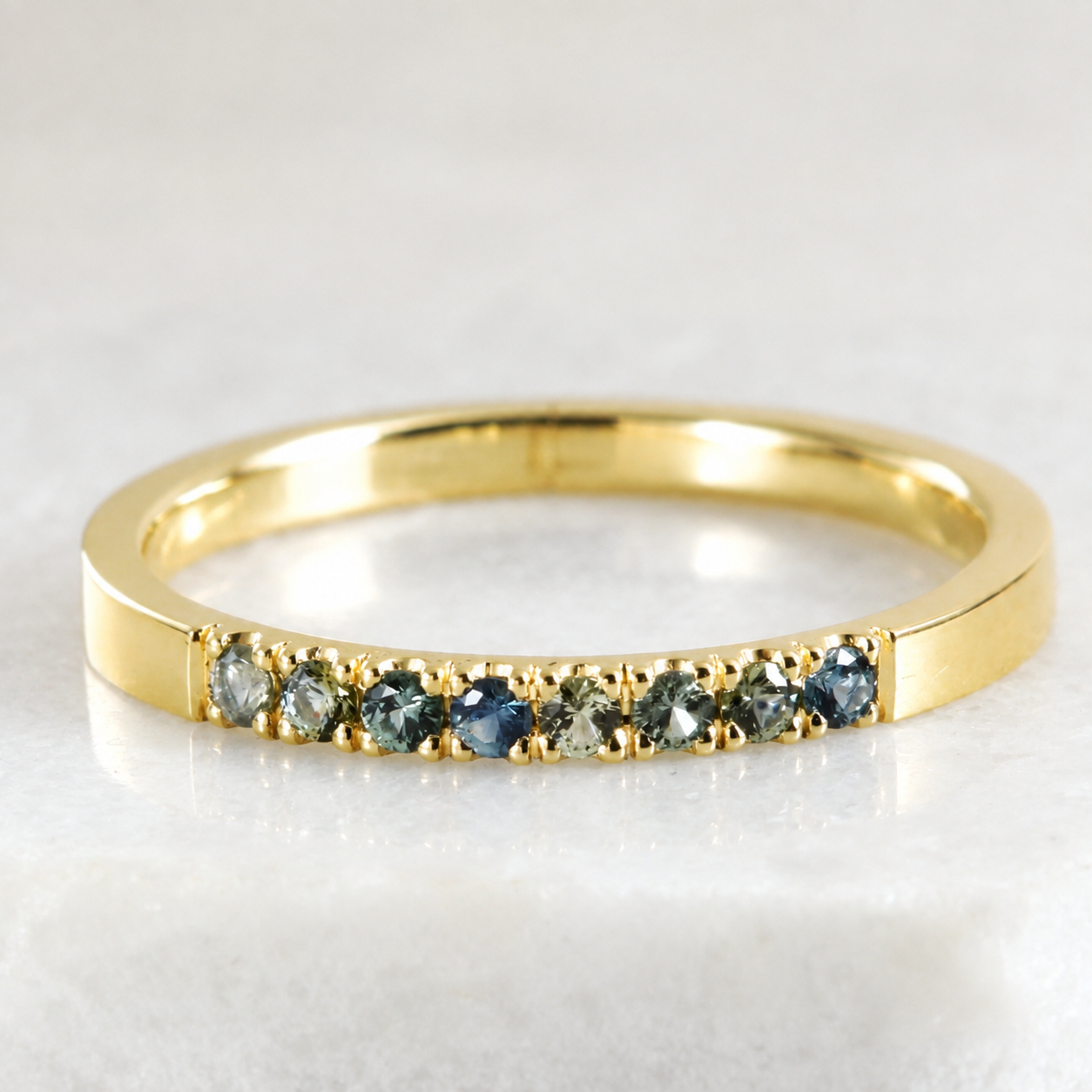A 14K gold stacking ring with Montana Sapphires