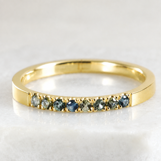 A 14K gold stacking ring with Montana Sapphires