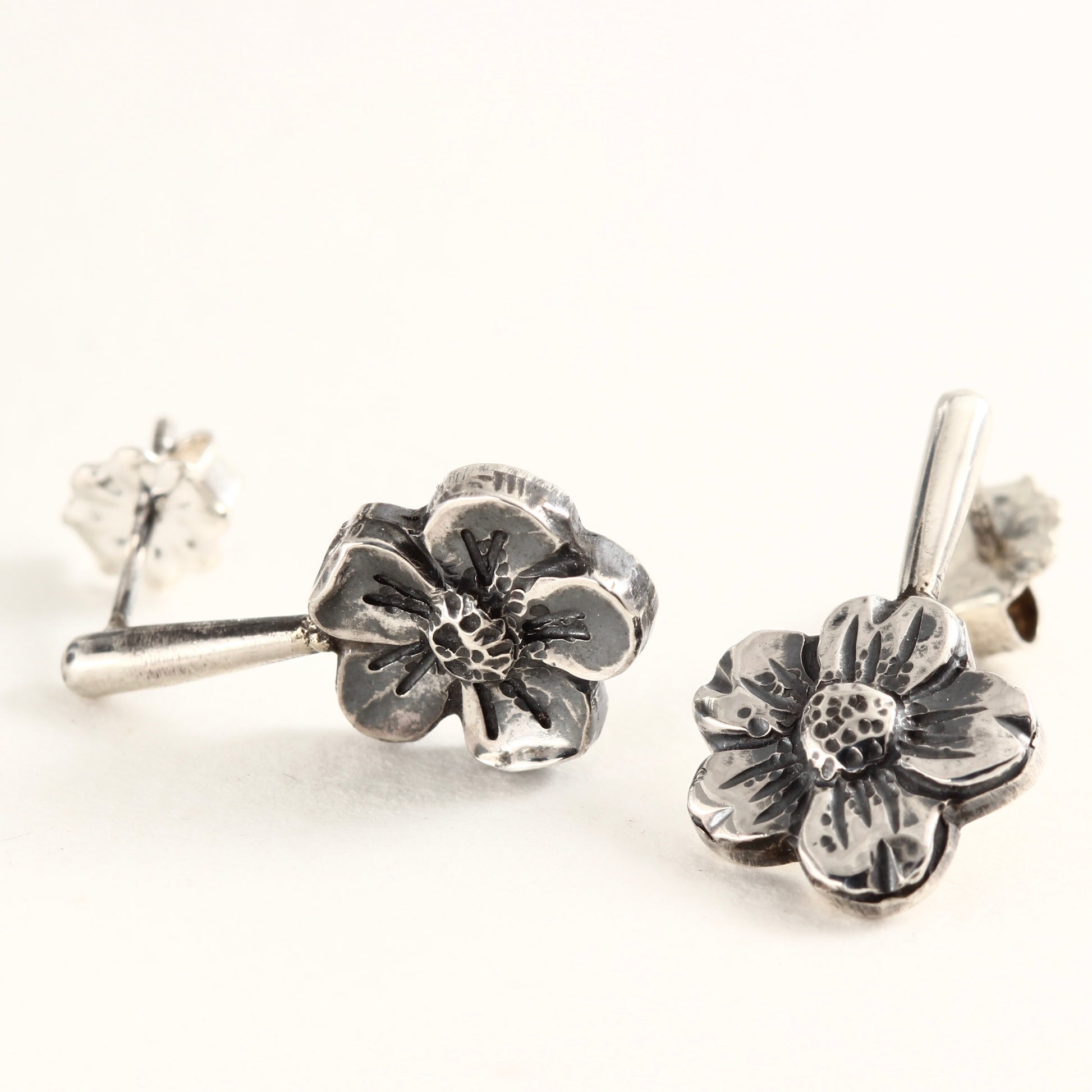 Wild Bloom Drop Earrings in sterling silver, handcrafted floral earrings, on white background