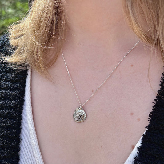 Wild Bloom Freeform Pendant in sterling silver, handcrafted floral pendant, shown on model