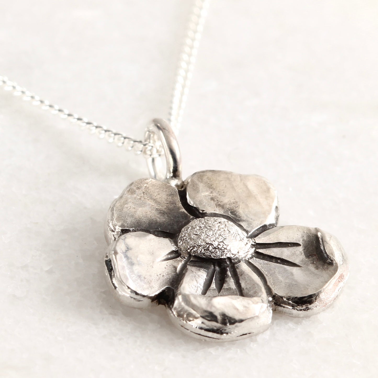 Wild Bloom Small Pendant in sterling silver, handcrafted flower necklace, on white background