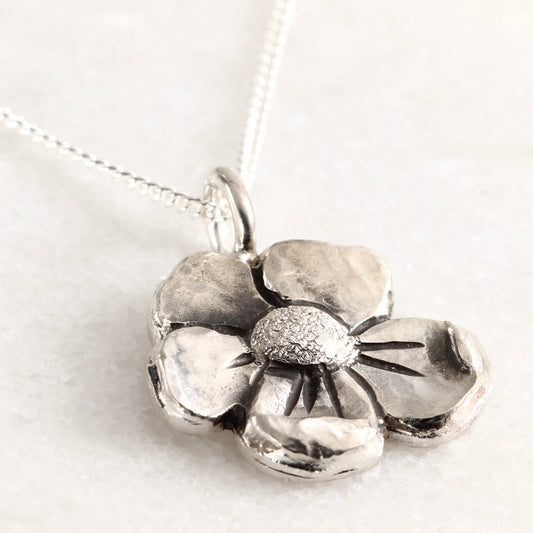 Wild Bloom Small Pendant in sterling silver, handcrafted flower necklace, on white background