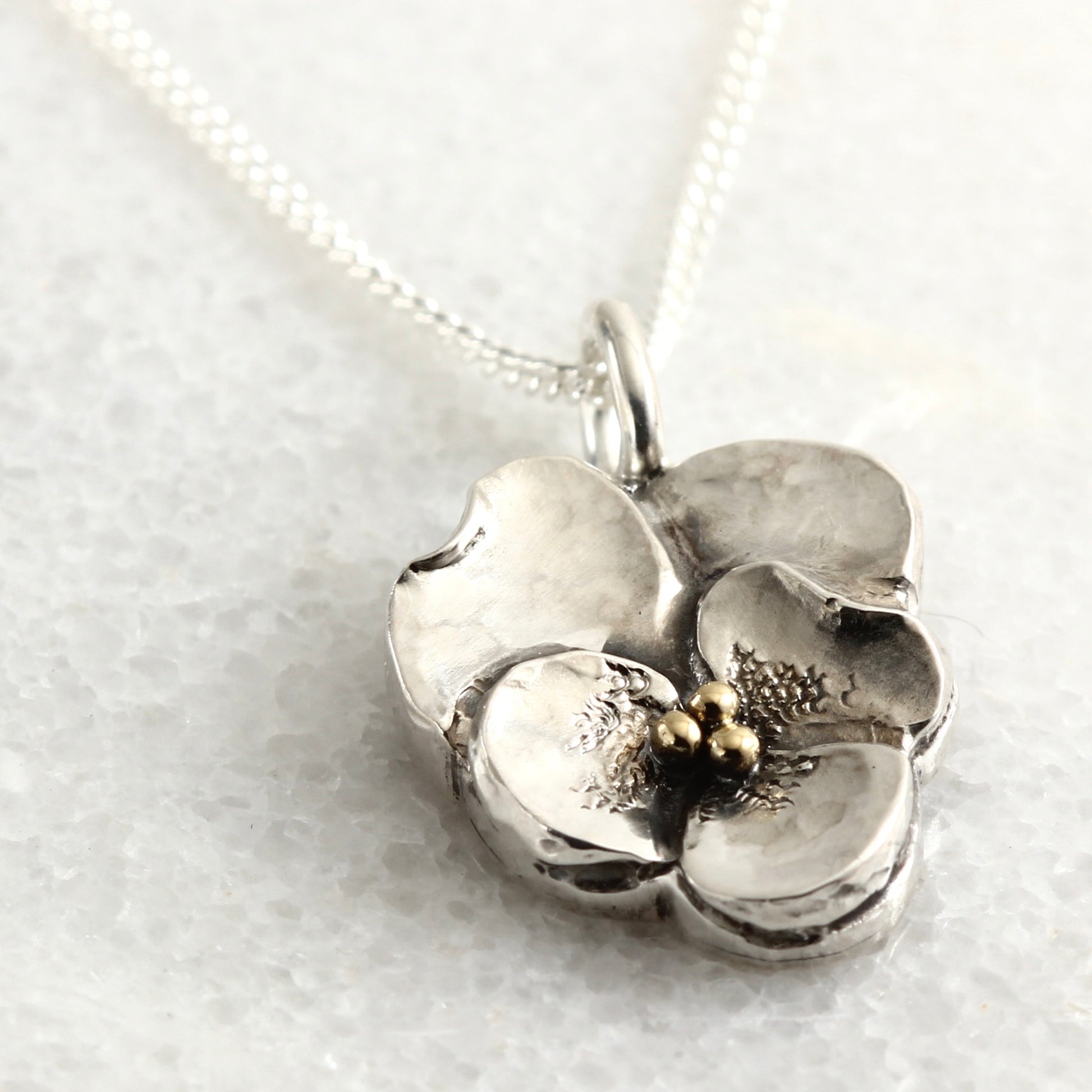 Wild Bloom Violet Pendant in sterling silver, handcrafted floral necklace, showing 18k gold accents