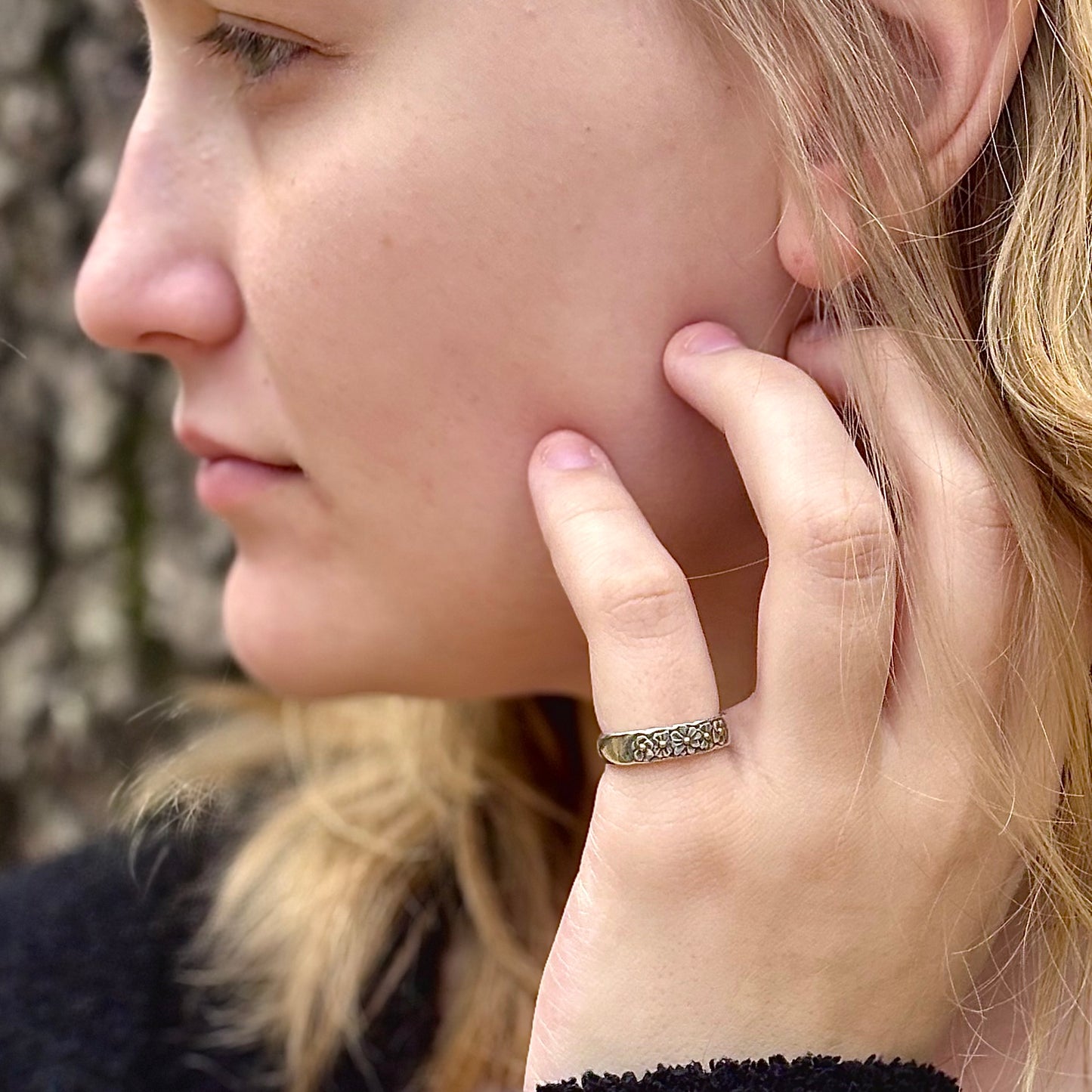 Wild Meadow Half band in sterling silver with gold accents, a hand carved flower ring shown on a model