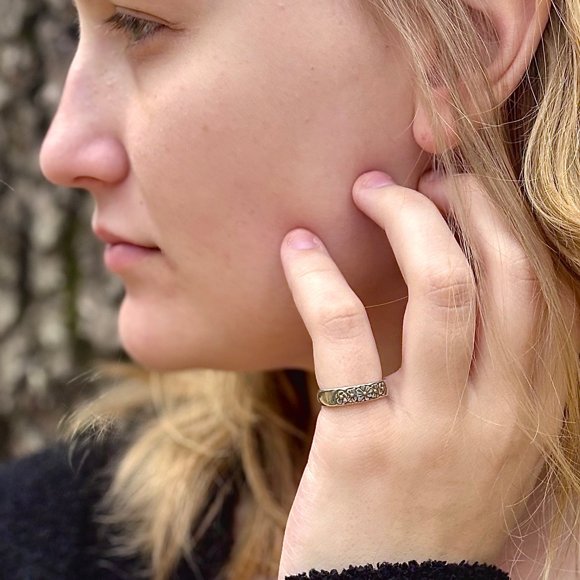 Wild Meadow Half band in sterling silver with gold accents, a hand carved flower ring shown on a model