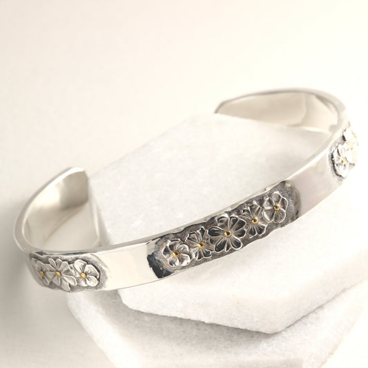 Hand-formed sterling silver cuff with 24k gold accents and engraved texture